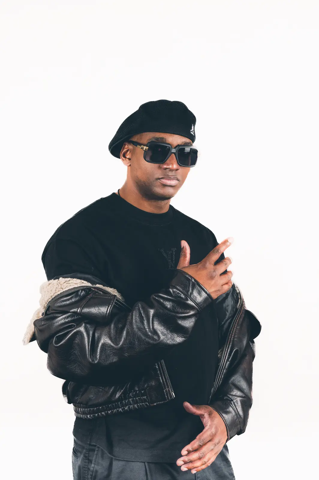 Hurrican X in a black beret and leather jacket on a white background